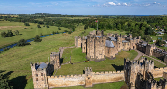Alnwick Castle from the air, the keep ringed by its inner and outer baileys